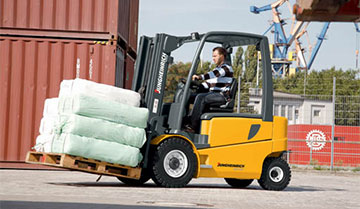 Operator Moving Materials Outdoors with a Jungheinrich EFG Forklift